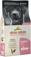 Купити корм для собак Almo Nature Holistic Puppy M Chicken 12 kg  за ціною від 2339 грн.